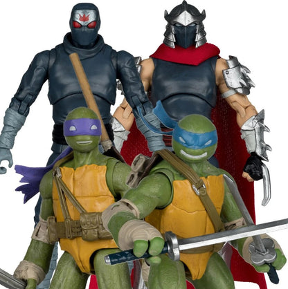 Four action figures of Teenage Mutant Ninja Turtles with masks and weapons on a white background