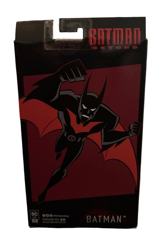 Batman-themed product packaging on a shelf with a blurred background