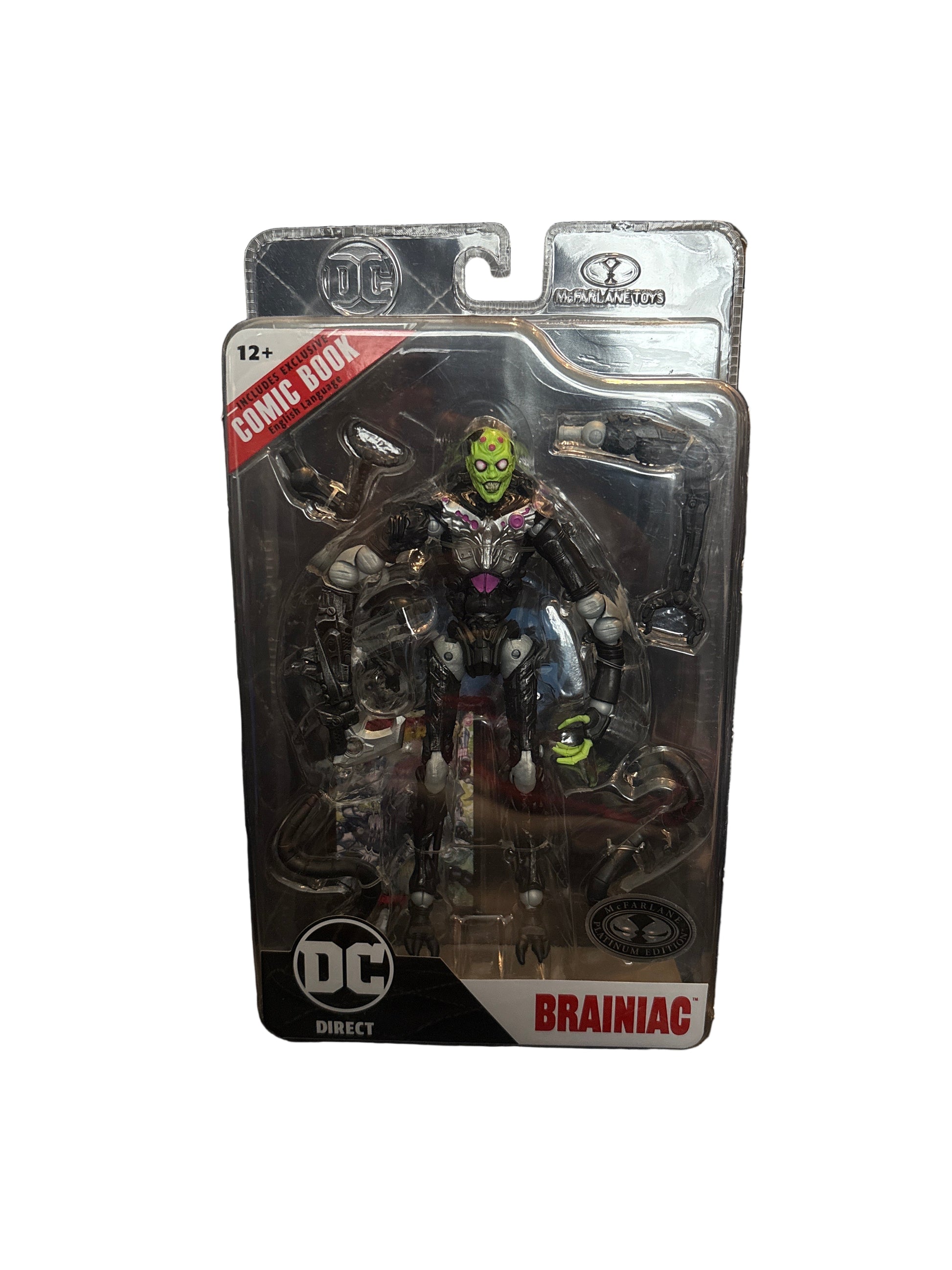 Toy figure in packaging with 'DC' branding on a textured surface