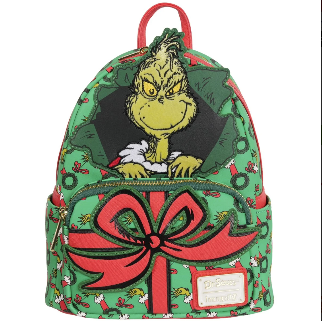Backpack with Grinch design featuring a large red bow on a white background