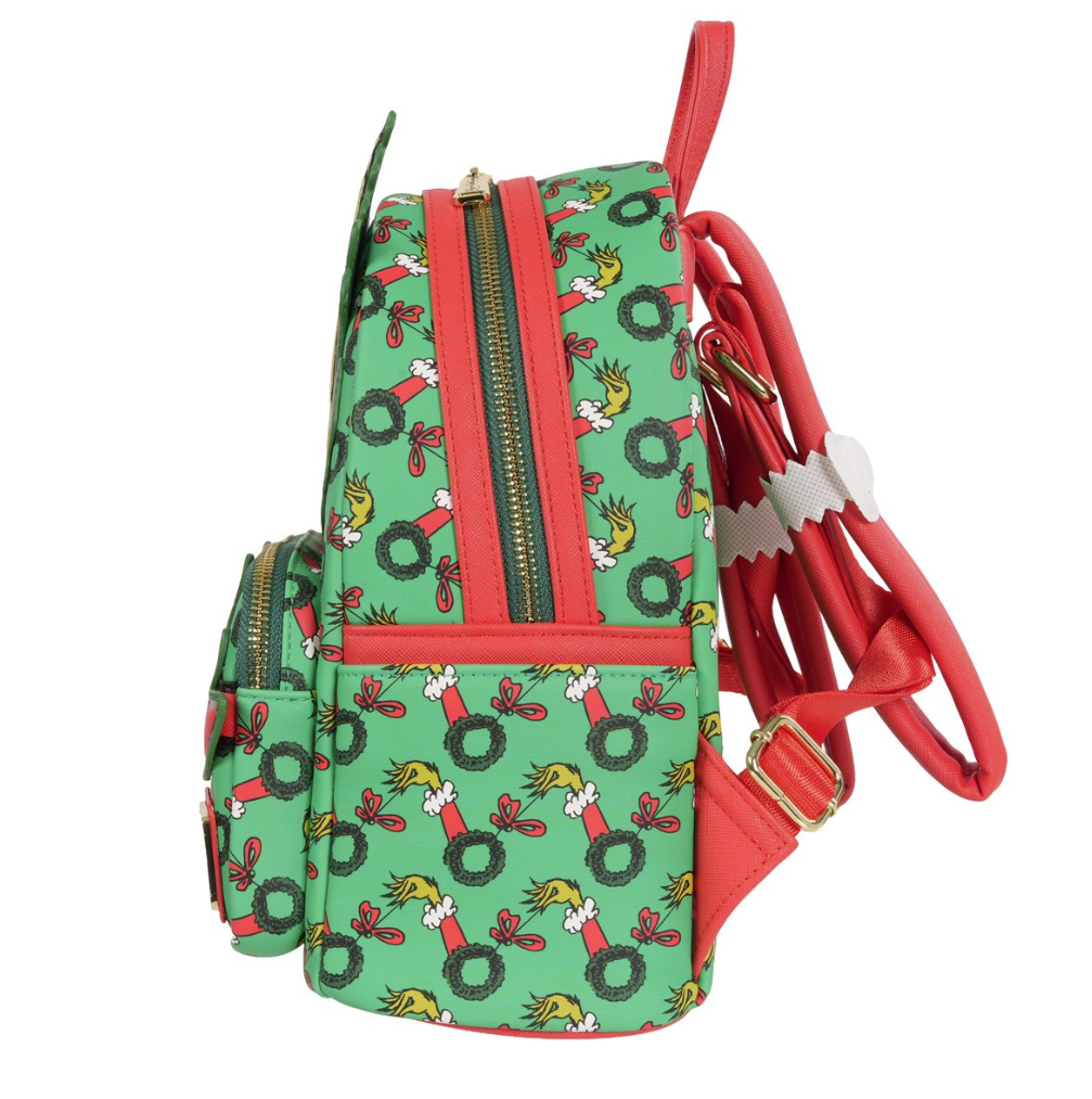 Backpack with festive design featuring wreaths and birds on a green background.
